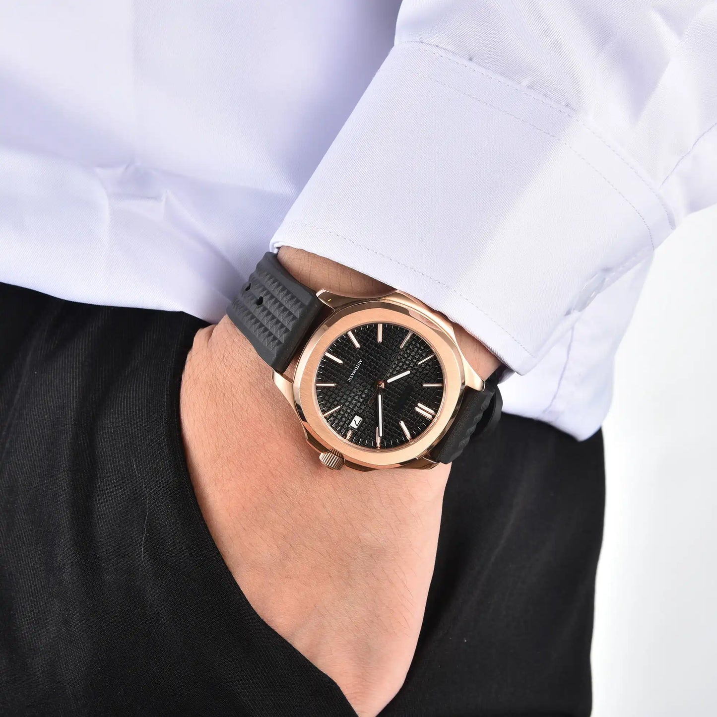 Men's rose gold black Aquanaut style Seiko mod watch on wrist, casual daily wear lifestyle shot