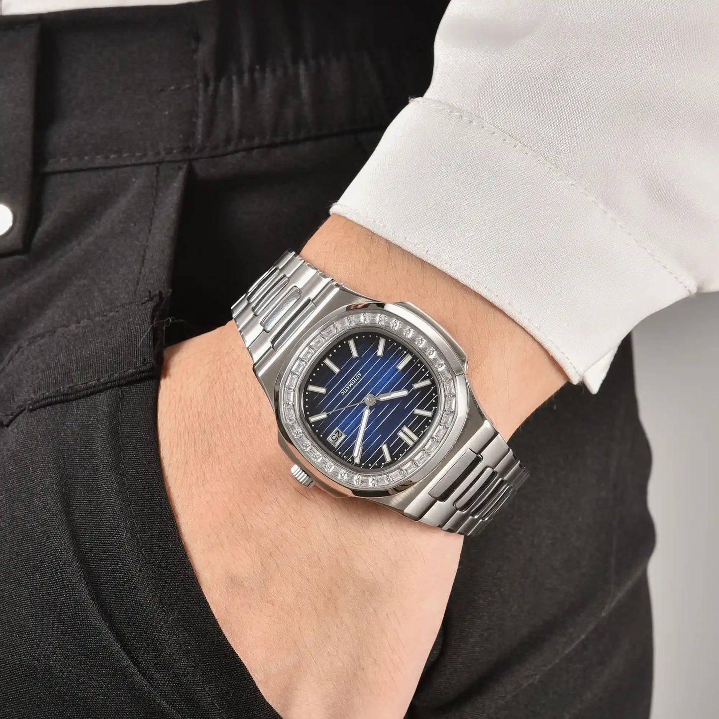 Men's diamond bezel Nautilus style Seiko mod watch on wrist, casual daily wear lifestyle shot