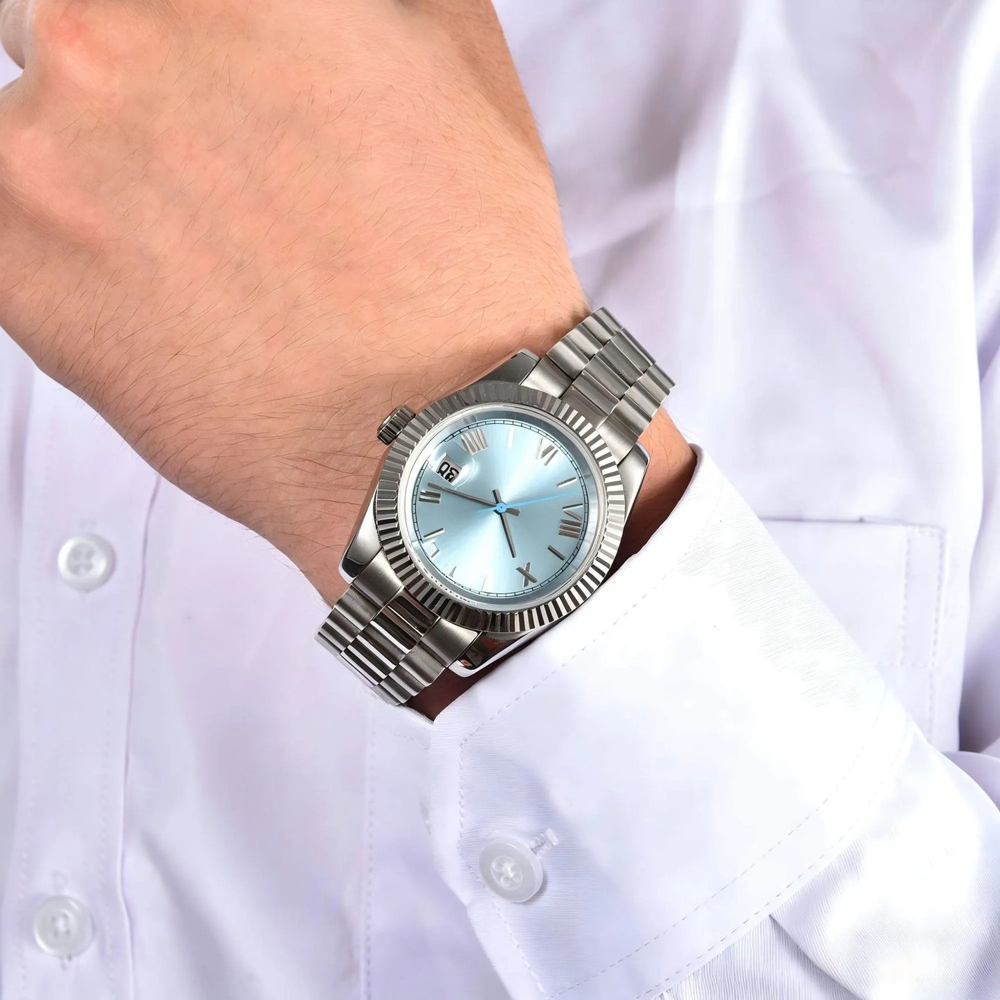 Ice blue Seiko mod watch worn on wrist, daily lifestyle shot