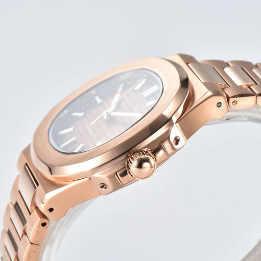 Side view of Nautilus style Seiko mod watch, polished stainless steel case and rose gold crown detail