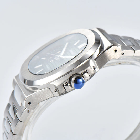 Side view of open heart Nautilus style Seiko mod watch, polished stainless steel case and silver crown detail