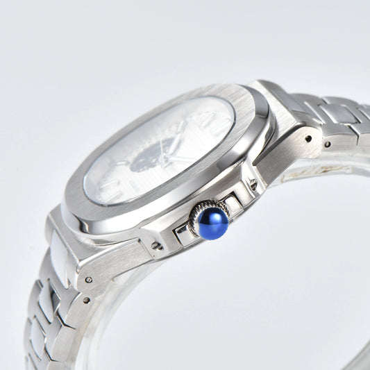 Side view of open heart Nautilus style Seiko mod watch, polished stainless steel case and silver crown detail