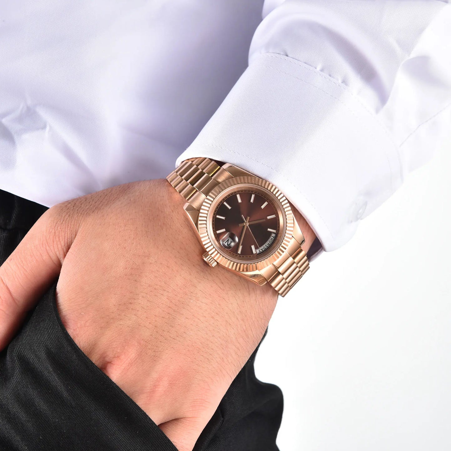 Men's rose gold Seiko mod watch on wrist, daily business lifestyle shot