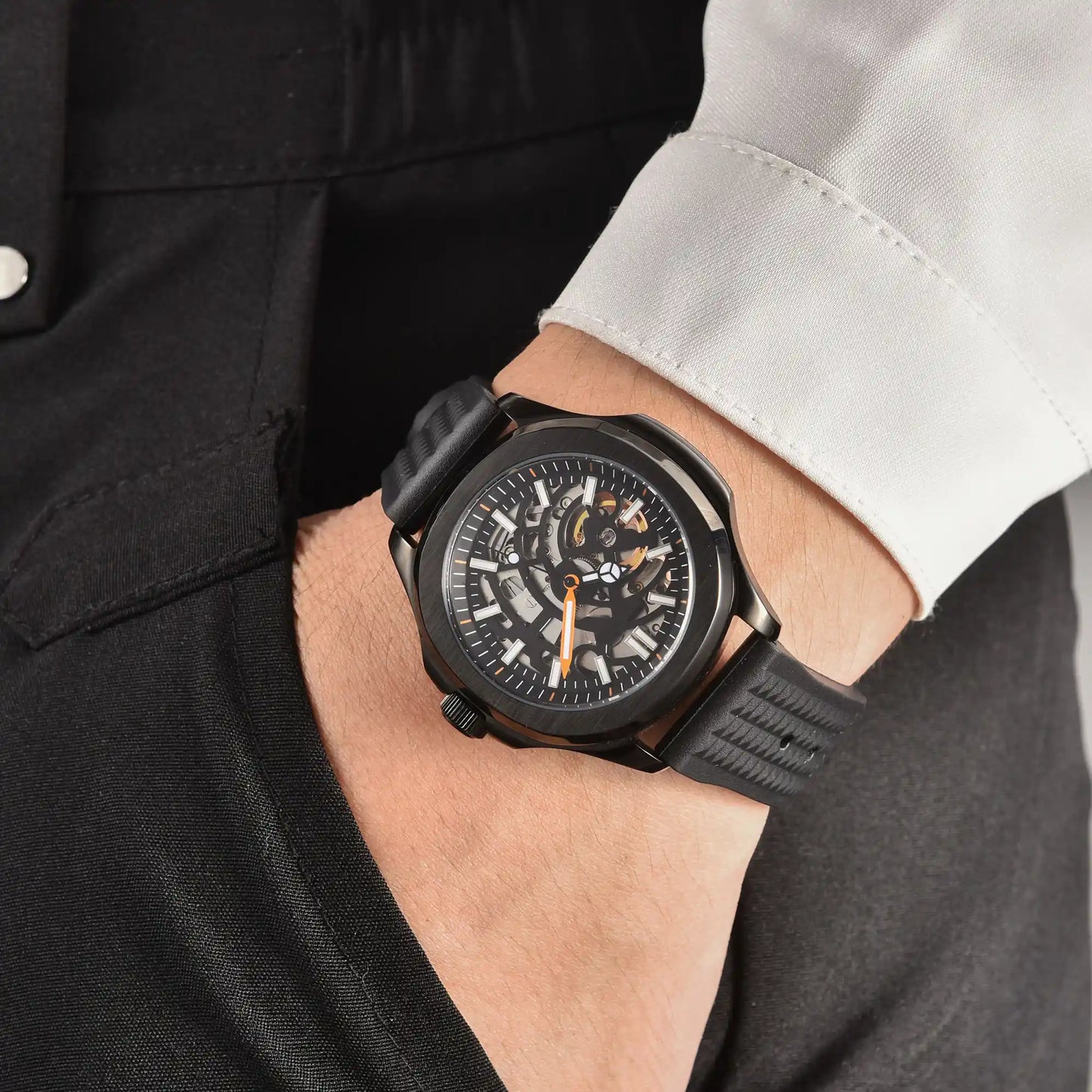Men's skeleton black Aquanaut style Seiko mod watch on wrist, casual daily wear lifestyle shot