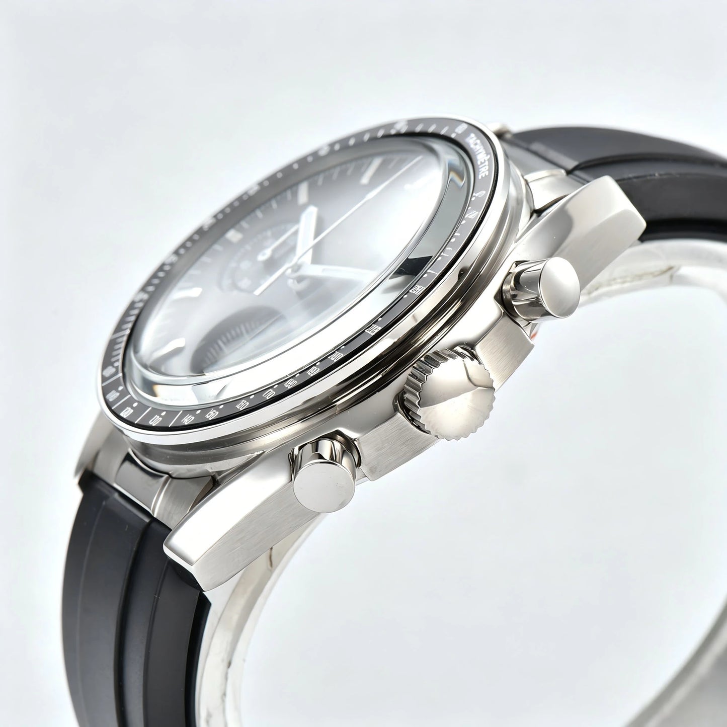 Side view of chronograph style Seiko mod watch, stainless steel pushers and tachymeter bezel detail