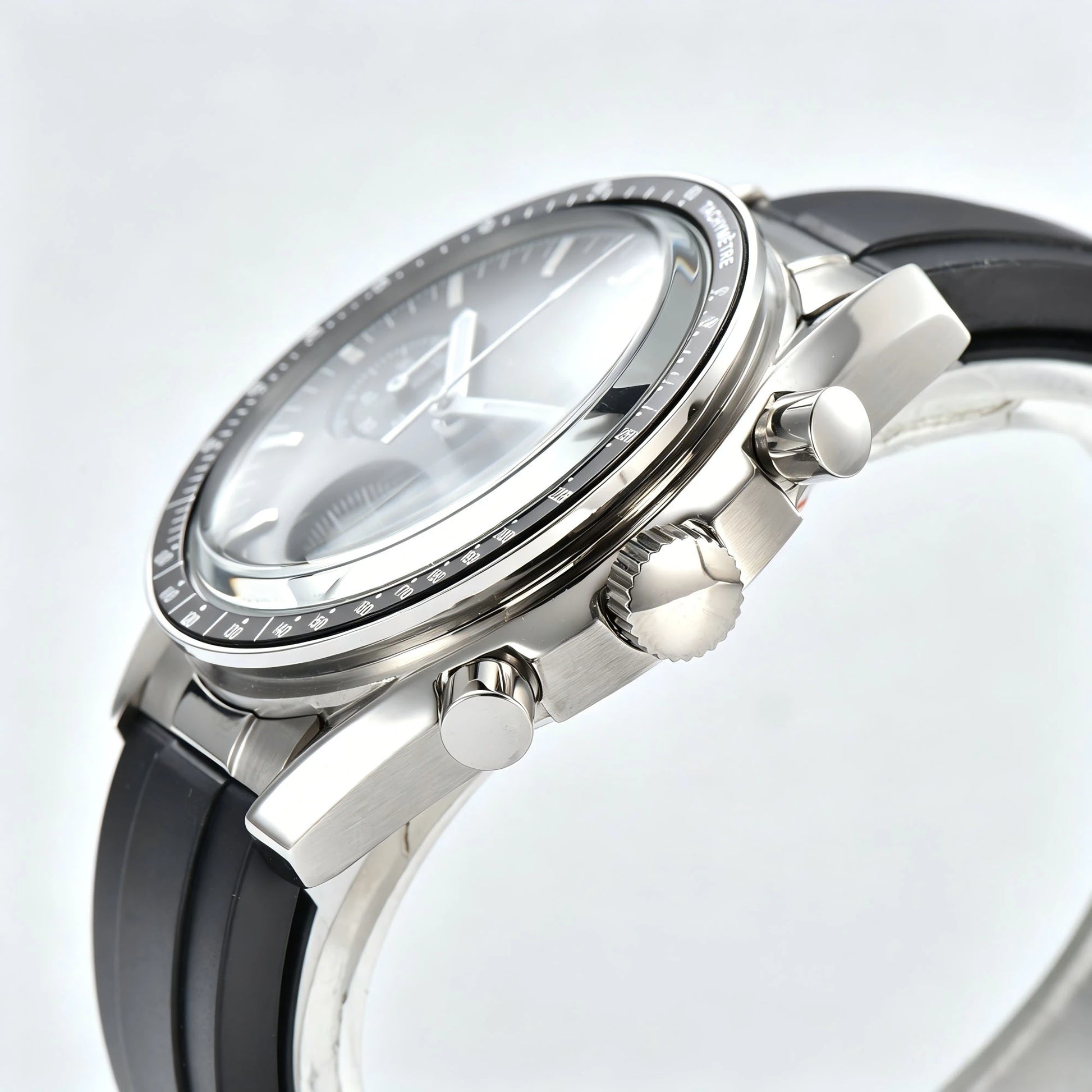 Side view of chronograph style Seiko mod watch, stainless steel pushers and tachymeter bezel detail
