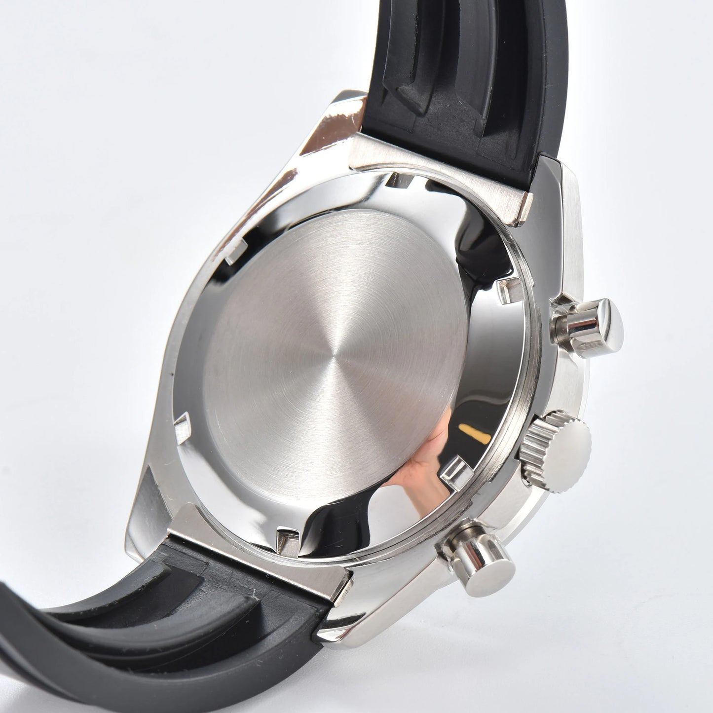 Side view of silver Seiko mod VK63 chronograph watch, polished stainless steel case back