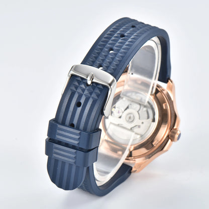 Transparent case back and pin buckle of rose gold Aquanaut style Seiko mod watch with blue rubber strap