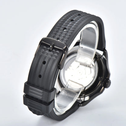 Transparent case back and pin buckle of stealth black Aquanaut style Seiko mod watch with black rubber strap