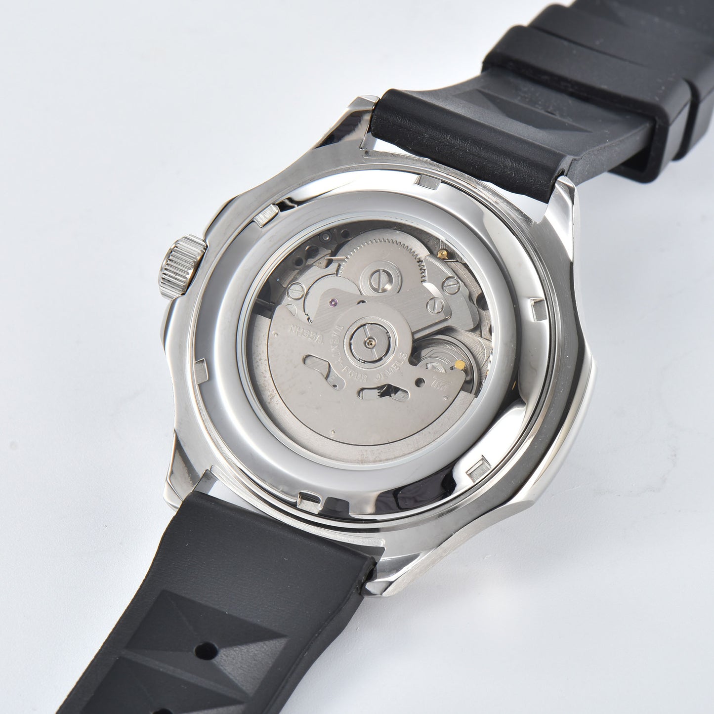 Clear case back showing Seiko NH35 automatic movement in silver Aquanaut style Seiko mod watch