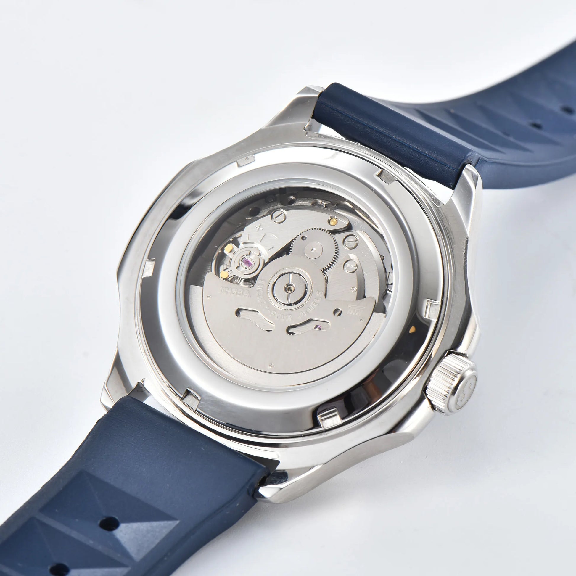 Clear case back showing Seiko NH35 automatic movement in silver blue Aquanaut style Seiko mod watch