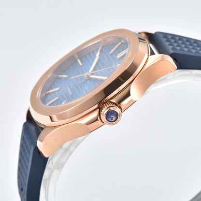 Side view of rose gold blue Aquanaut style Seiko mod watch, polished stainless steel case and crown detail