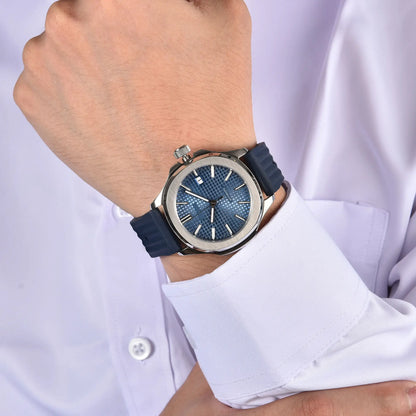Silver Aquanaut style Seiko mod watch with blue rubber strap on wrist, business lifestyle shot