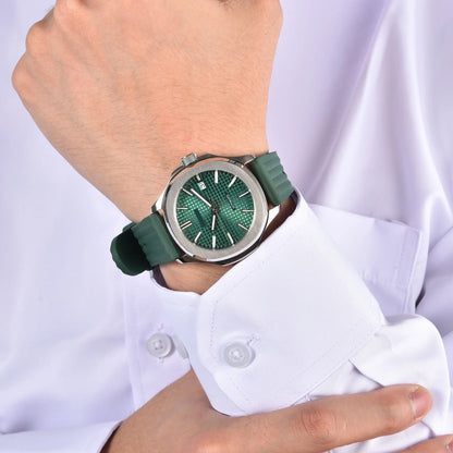 Silver Aquanaut style Seiko mod watch with green rubber strap on wrist, business lifestyle shot