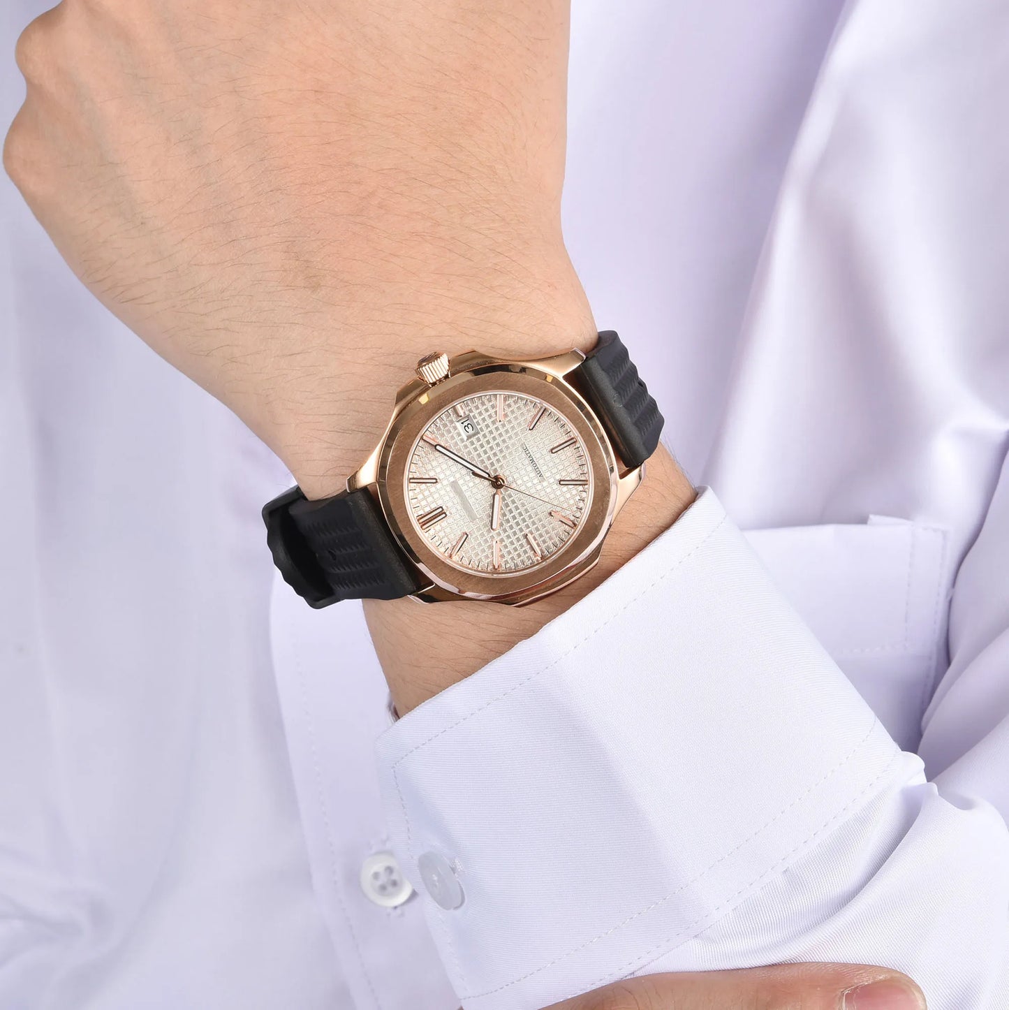 Rose gold white Aquanaut style Seiko mod watch with black rubber strap on wrist, business lifestyle shot
