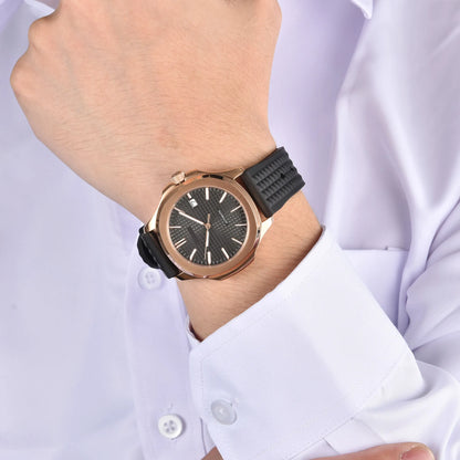Rose gold Aquanaut style Seiko mod watch with black rubber strap on wrist, business lifestyle shot