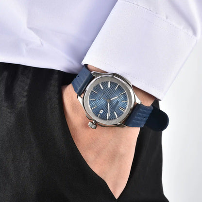 Men's silver blue Aquanaut style Seiko mod watch on wrist, casual daily wear lifestyle shot