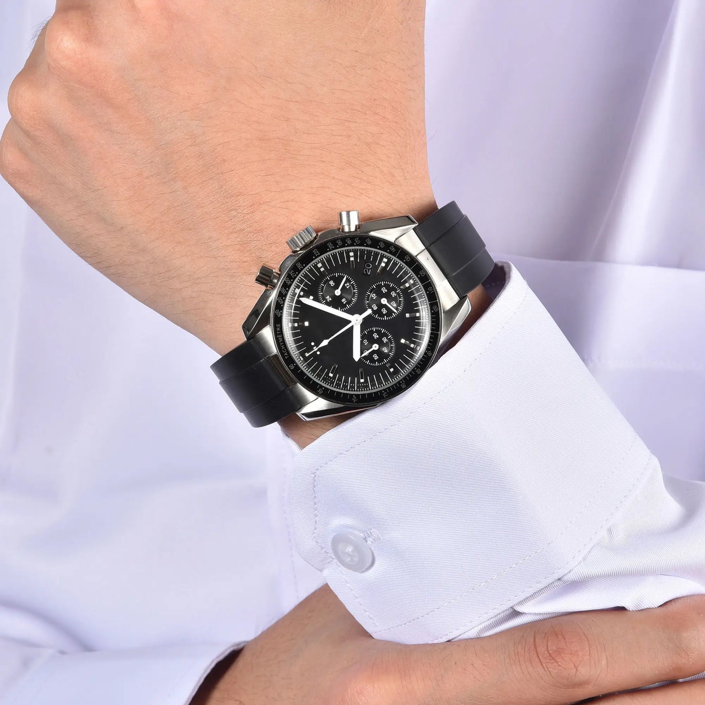 Silver black chronograph speedmaster style Seiko mod watch on wrist, business lifestyle shot