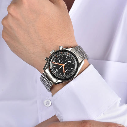 Silver black orange chronograph speedmaster style Seiko mod watch on wrist, business lifestyle
