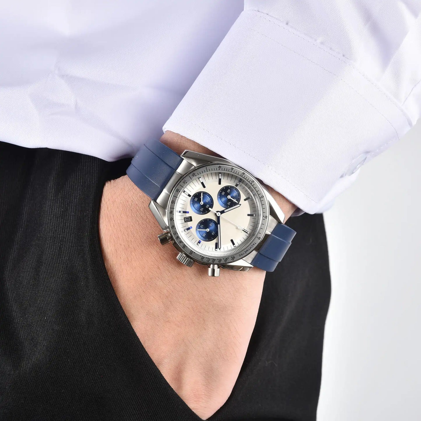 Men's silver blue chronograph speedmaster Seiko mod watch on wrist, casual daily wear shot