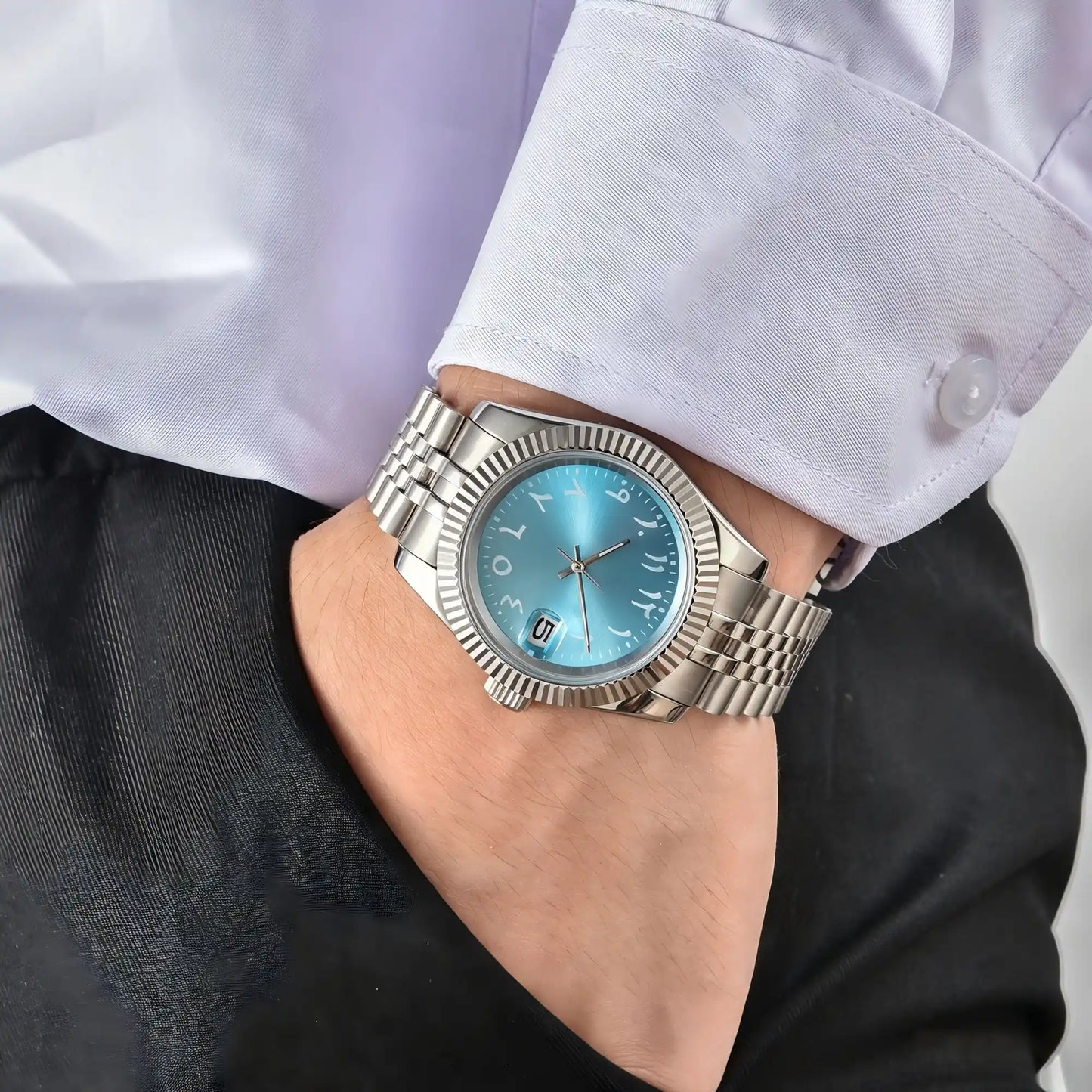 Wrist shot of custom Seiko mod watch worn with a formal suit, showcasing the polished finish and refined dial details