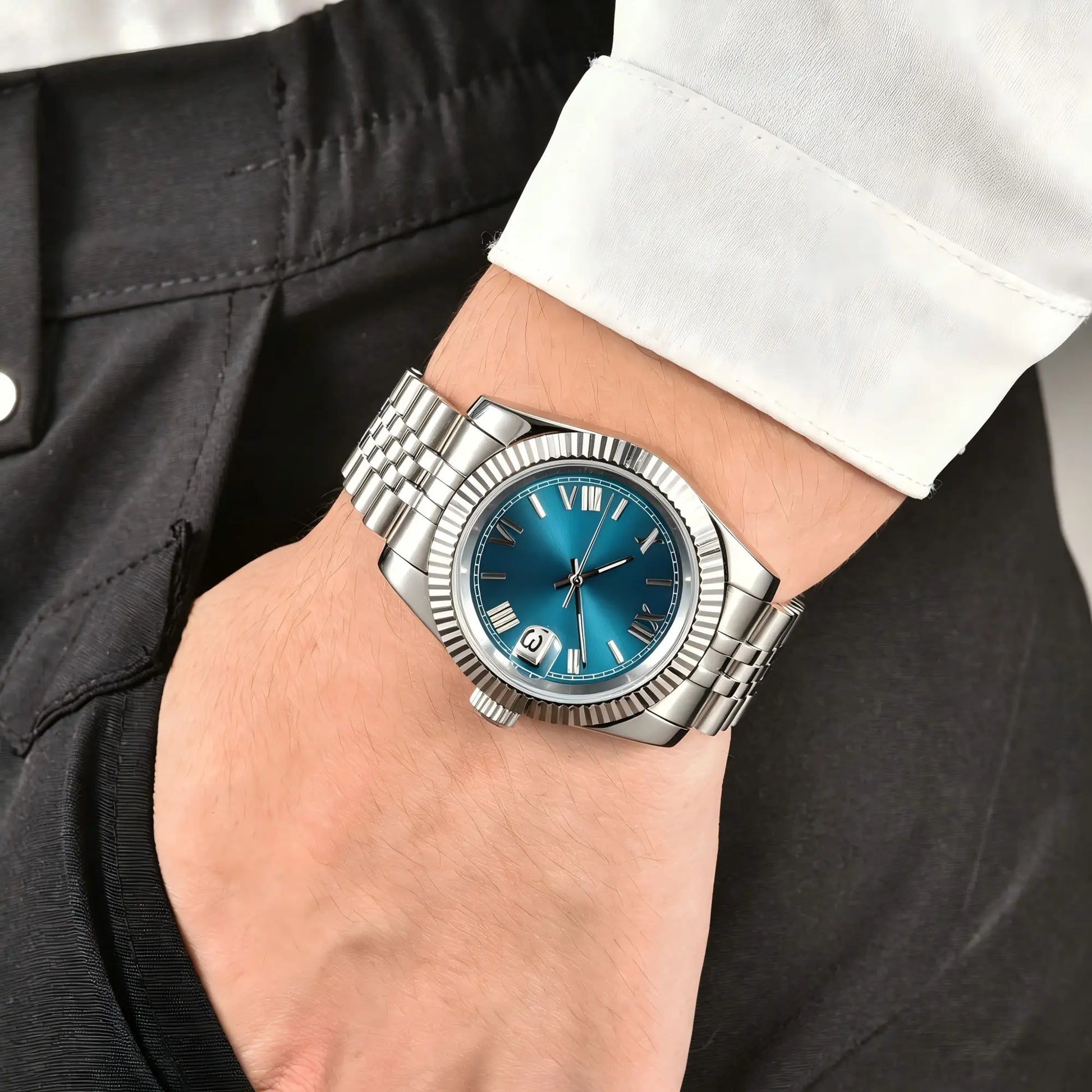 Wrist shot of custom Seiko mod watch worn with a formal suit, showcasing the polished finish and refined dial details