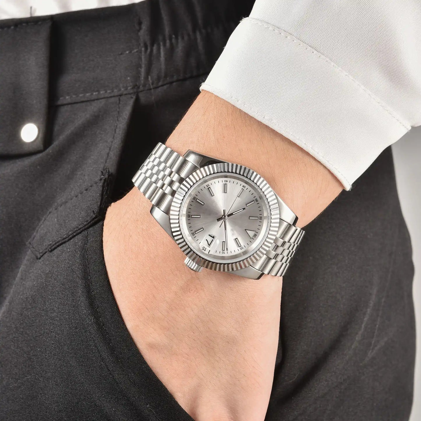 Wrist shot of custom Seiko mod watch worn with a formal suit, showcasing the polished finish and refined dial details