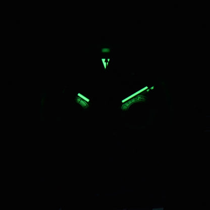 Luminous green hands and dial of VK63  Daytona style Seiko mod chronograph watch in dark environment