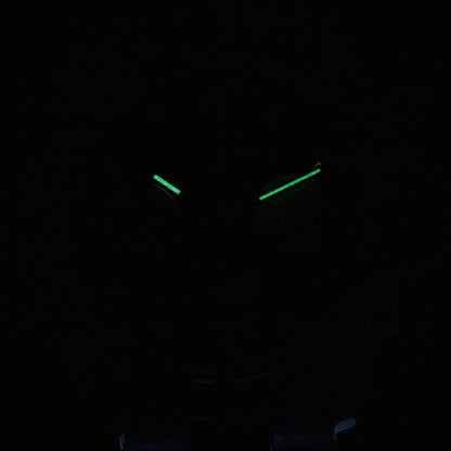 Luminous green hands of rainbow gem bezel Daytona style Seiko mod chronograph watch in dark environment