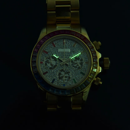 Luminous green hands of rainbow gem bezel Daytona style Seiko mod chronograph watch in dark environment