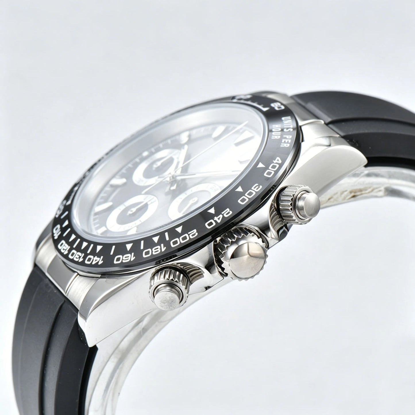 Side angle view of black panda Daytona style Seiko mod watch, black ceramic tachymeter bezel detail