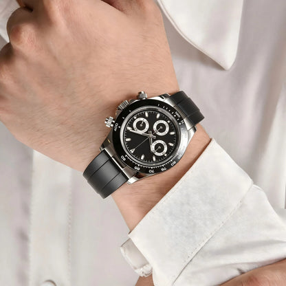 Men's black panda VK63 Daytona style Seiko mod chronograph watch on wrist, business lifestyle shot