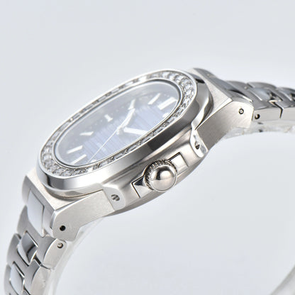 Side view of diamond bezel Nautilus style Seiko mod watch, polished stainless steel case and crown detail