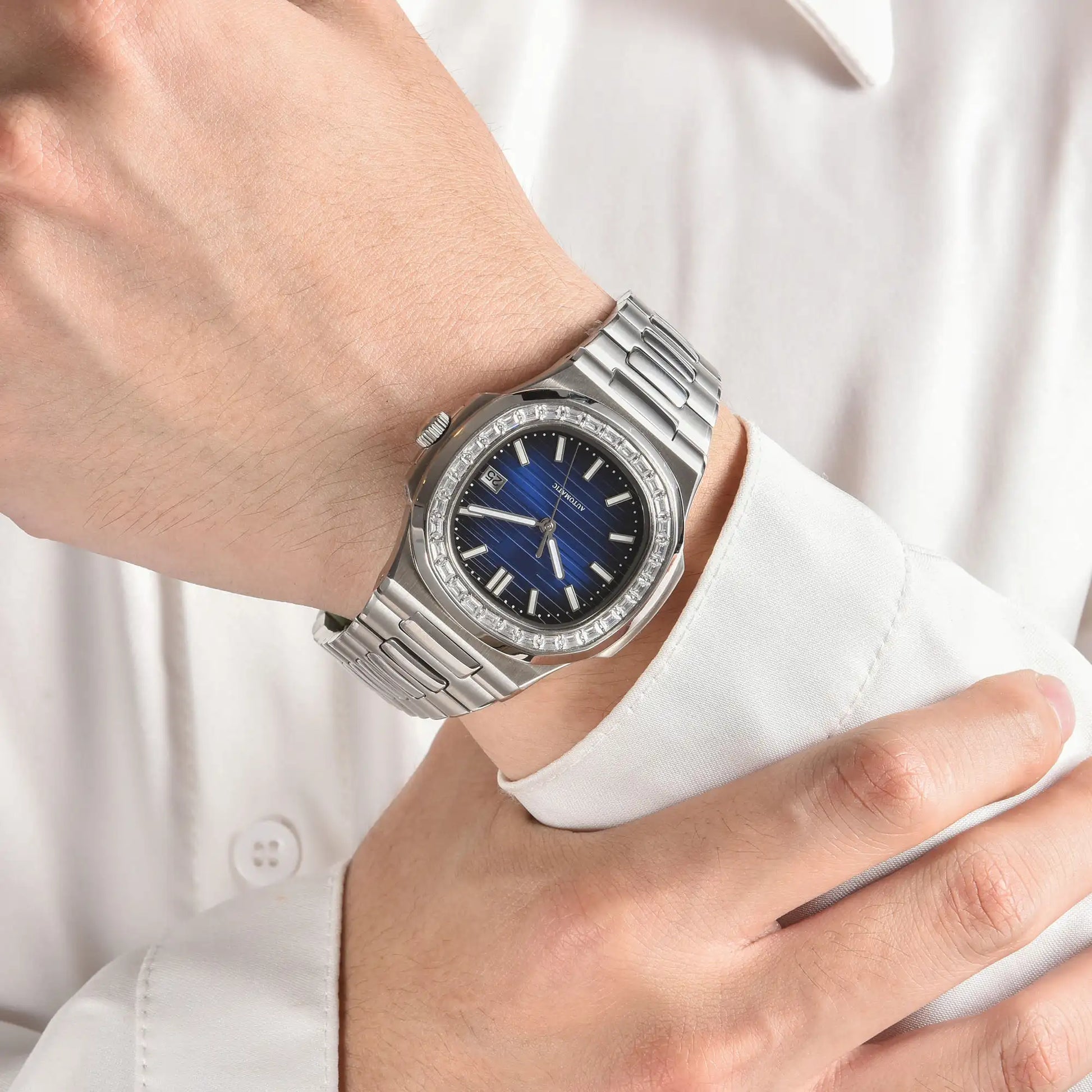 Diamond bezel Nautilus style Seiko mod watch with stainless steel bracelet on wrist, business lifestyle shot
