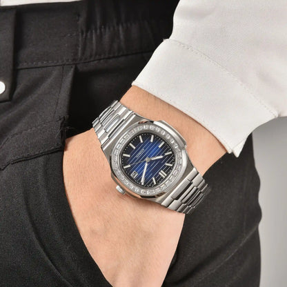 Men's diamond bezel Nautilus style Seiko mod watch on wrist, casual daily wear lifestyle shot