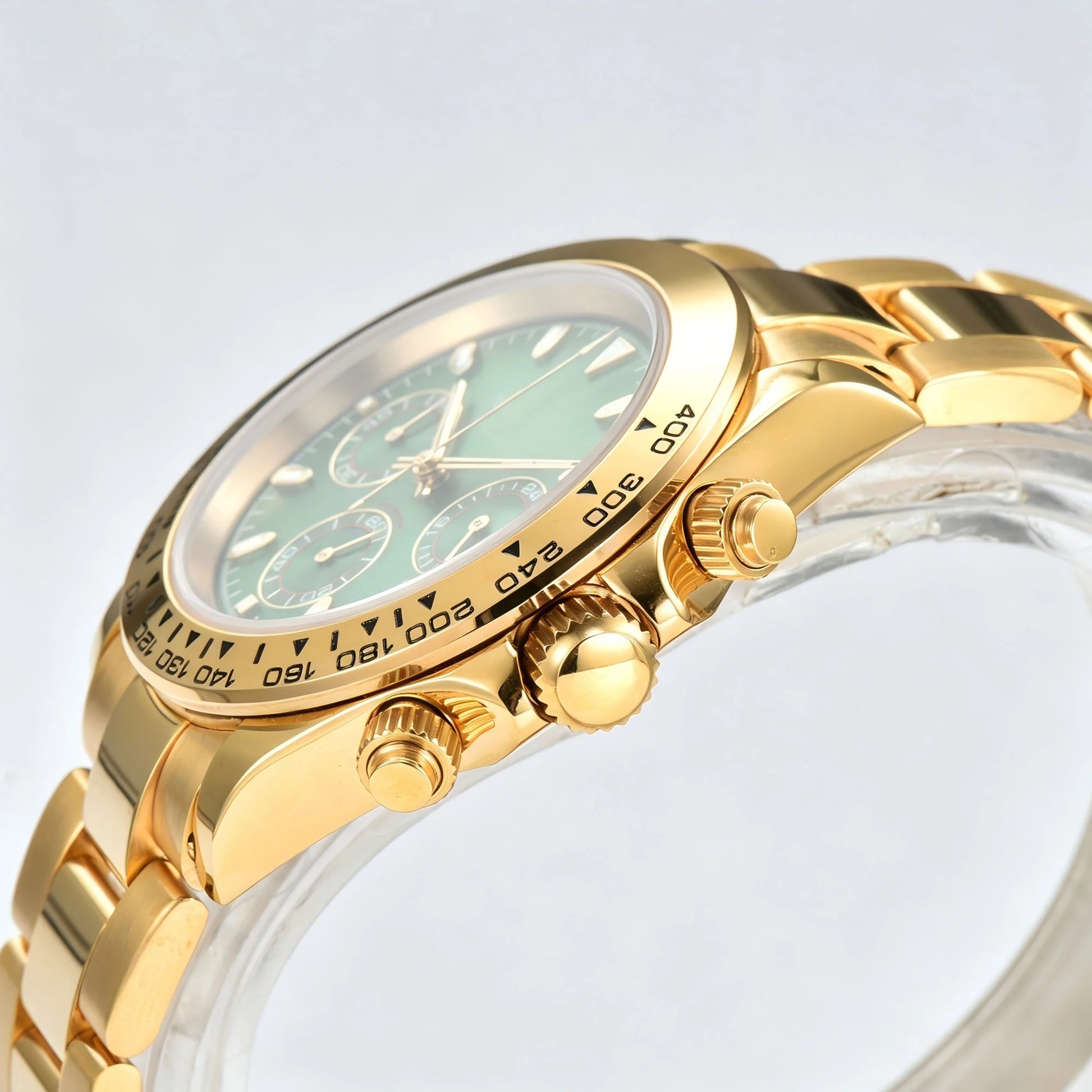 Side angle view of gold green VK63 Daytona style Seiko mod watch, gold tachymeter bezel detail