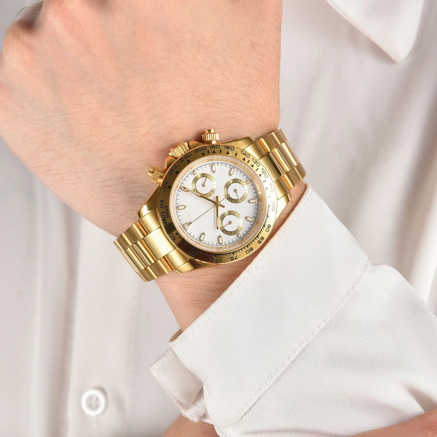 Men's gold white VK63 Daytona style Seiko mod chronograph watch on wrist, business lifestyle shot