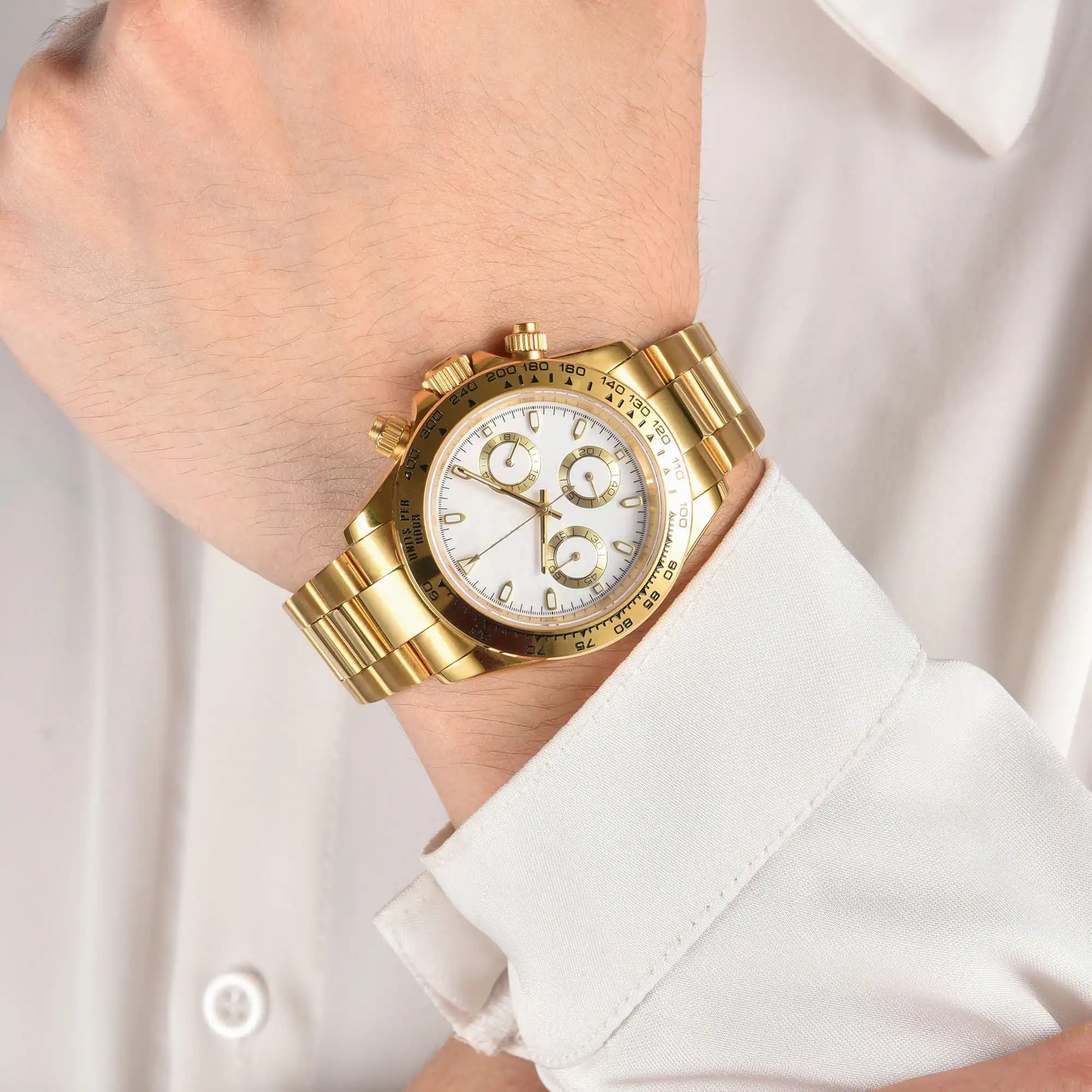 Men's gold white VK63 Daytona style Seiko mod chronograph watch on wrist, business lifestyle shot