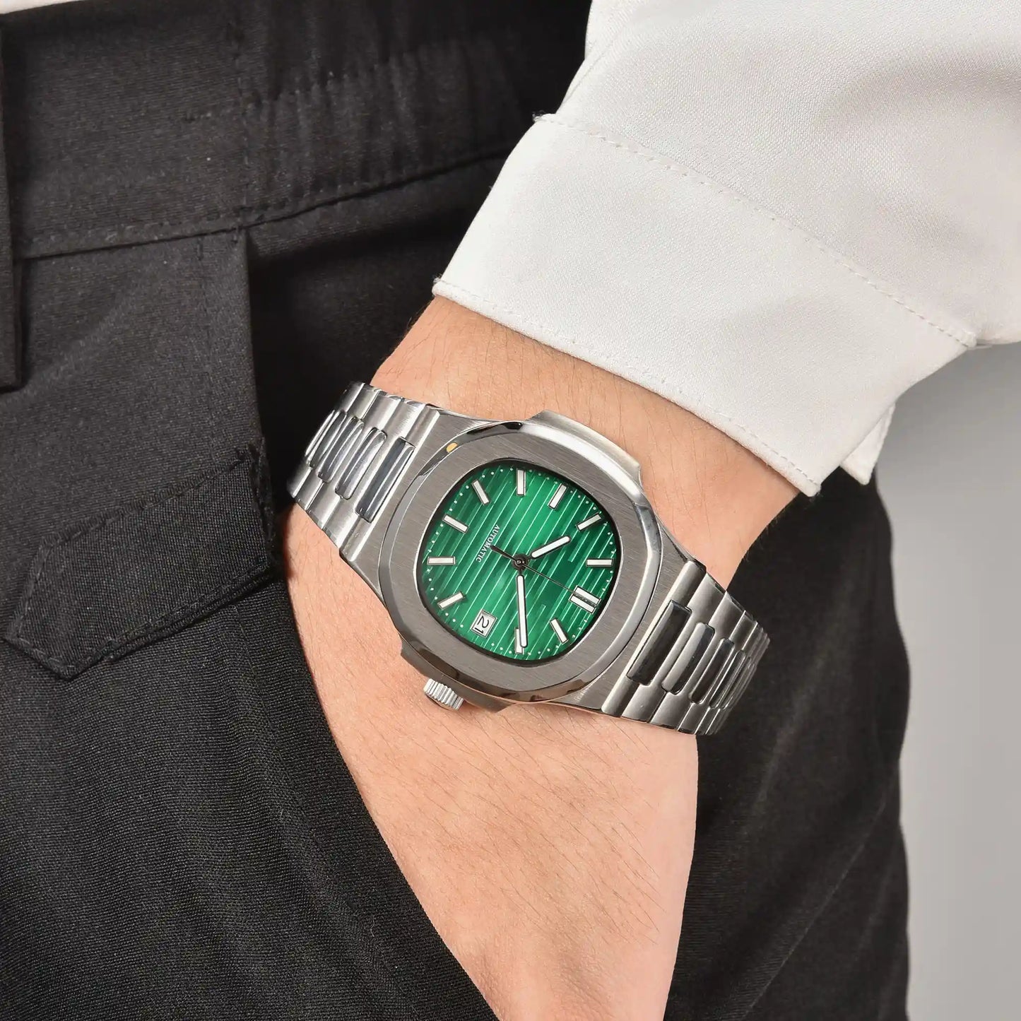 Men's green dial Nautilus style Seiko mod watch on wrist, casual daily wear lifestyle shot
