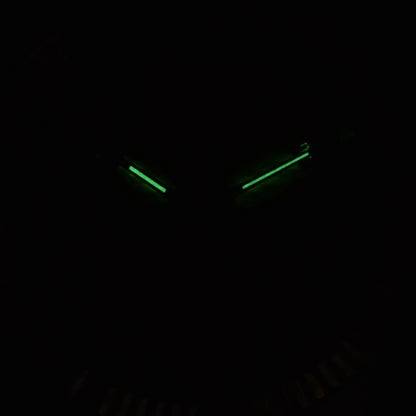 Low light close-up of Seiko mod watch hands showing strong C3 Super-LumiNova 