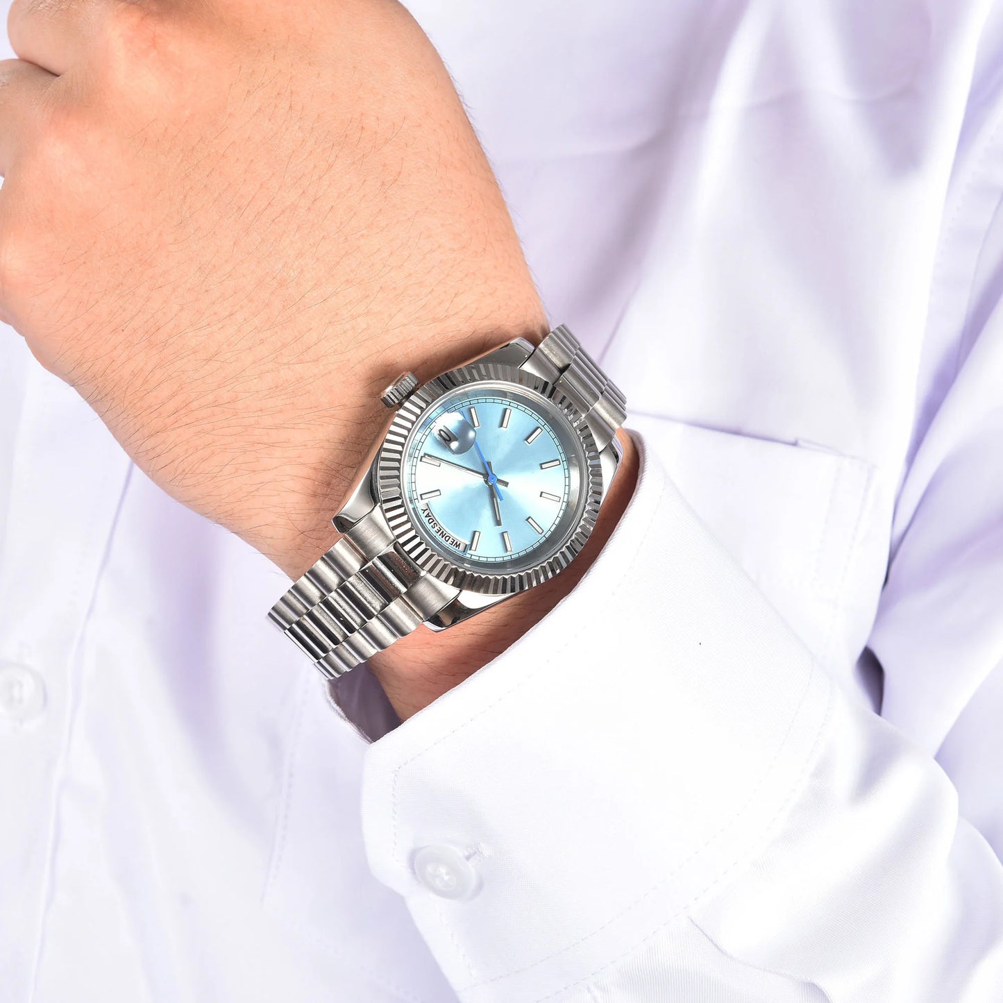 Ice blue Seiko mod watch worn on wrist, daily lifestyle shot