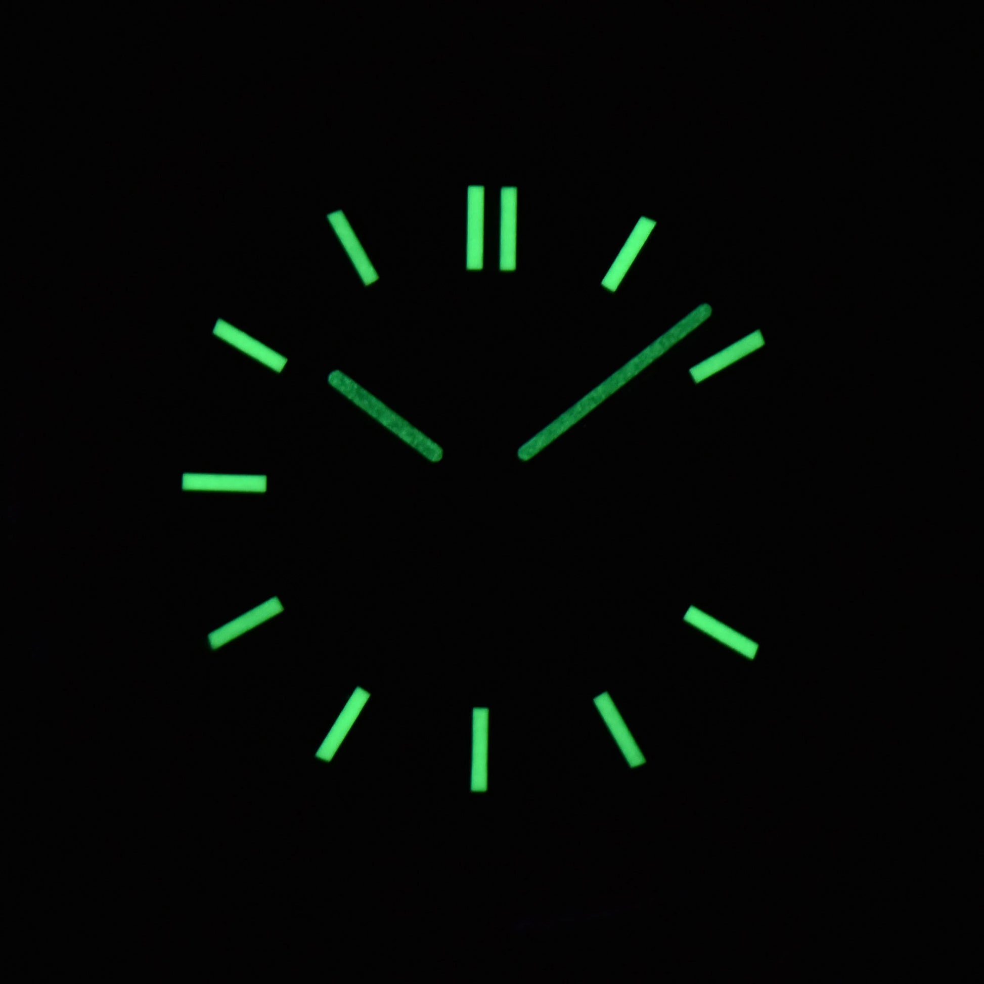 Luminous green dial and hands of NH35 Nautilus style Seiko mod watch in dark environment