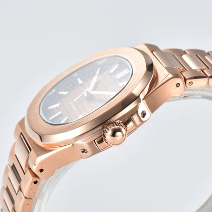 Side view of Nautilus style Seiko mod watch, polished stainless steel case and rose gold crown detail
