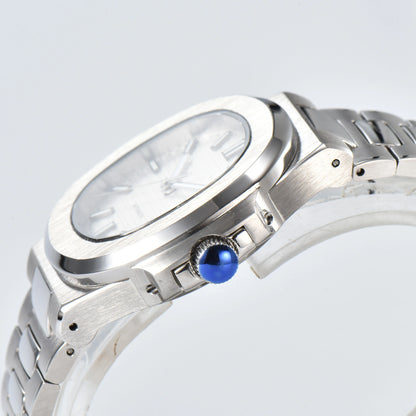 Side view of Nautilus style Seiko mod watch, polished stainless steel case and silver crown detail