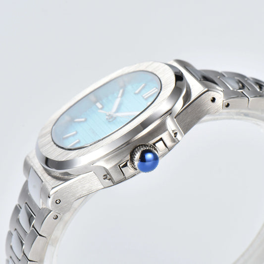 Side view of Nautilus style Seiko mod watch, polished stainless steel case and silver crown detail