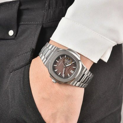 Men's brown open heart dial Nautilus style Seiko mod watch on wrist, casual daily wear lifestyle shot