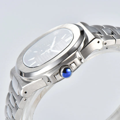 Side view of open heart Nautilus style Seiko mod watch, polished stainless steel case and silver crown detail