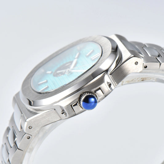 Side view of open heart Nautilus style Seiko mod watch, polished stainless steel case and silver crown detail