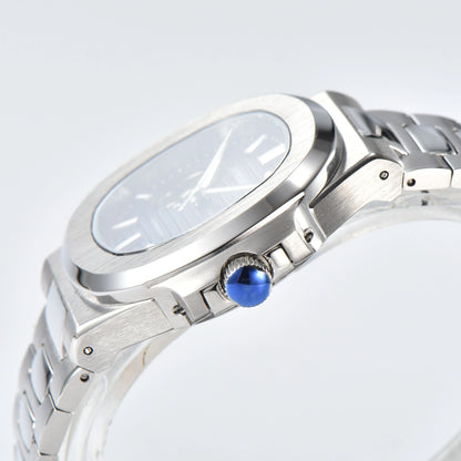 Side view of open heart Nautilus style Seiko mod watch, polished stainless steel case and silver crown detail