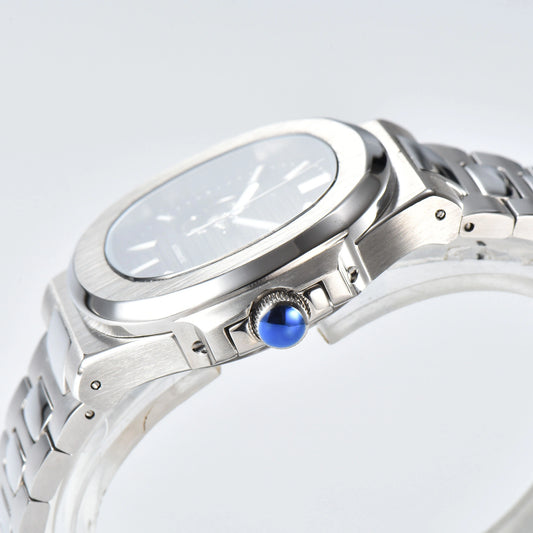 Side view of open heart Nautilus style Seiko mod watch, polished stainless steel case and silver crown detail